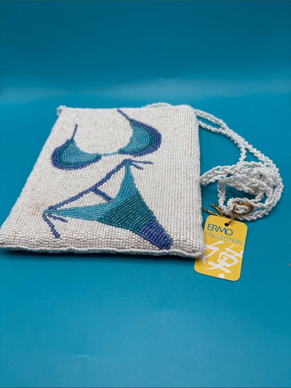 Ermo collection white beaded purse with bikini design